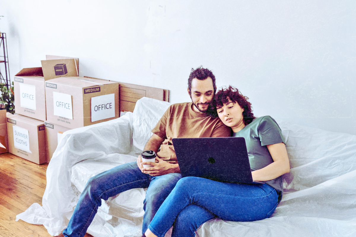 Couple reviewing listings on a laptop