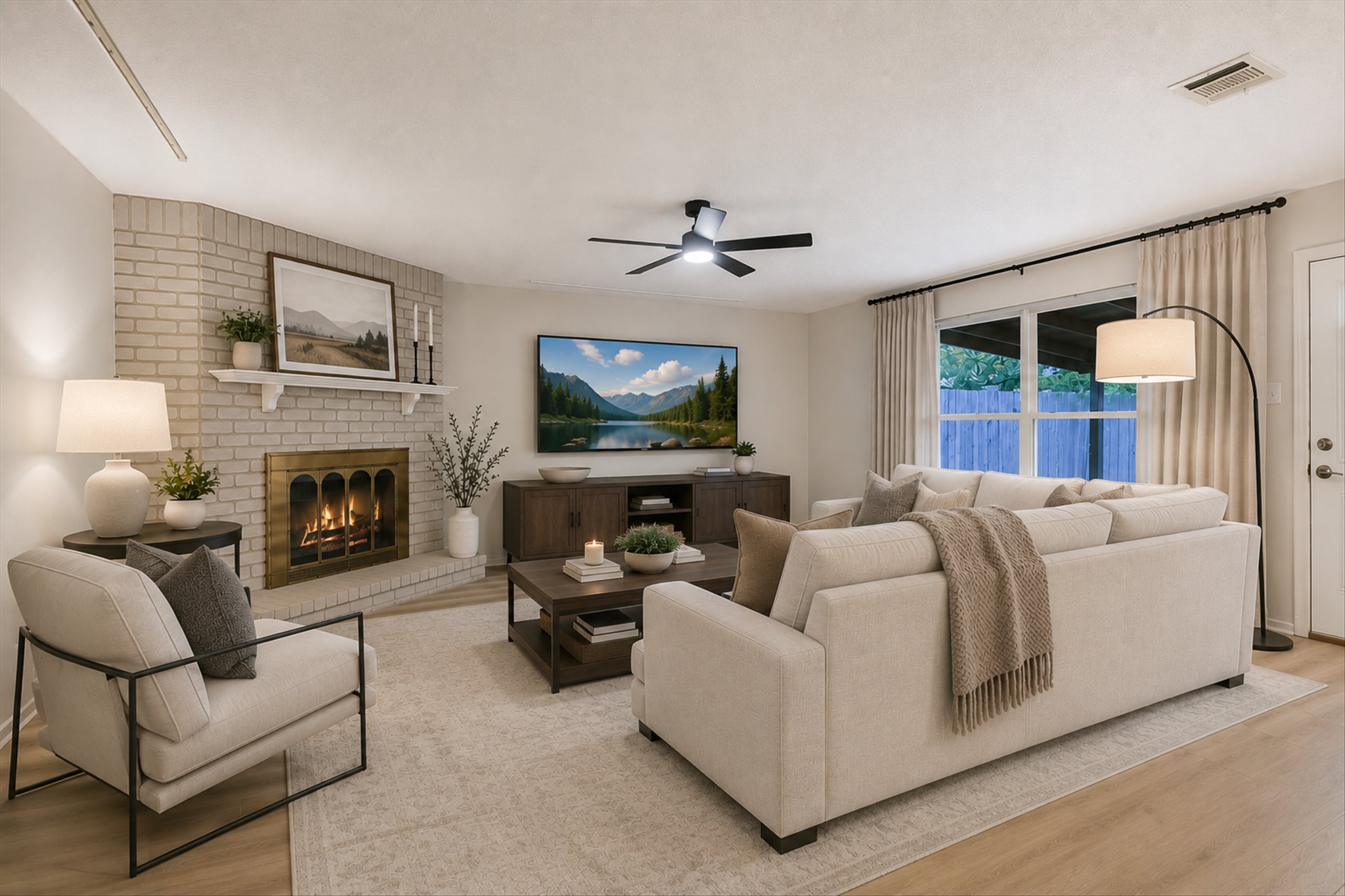 Renovated living room with a classic brick fireplace
